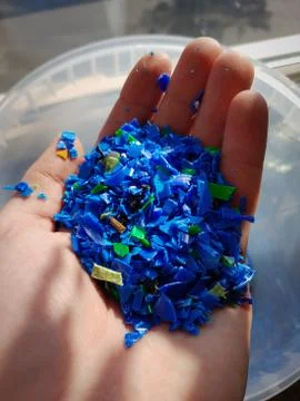 Plastic granulate polypropylene close up in hand Stock Photos
