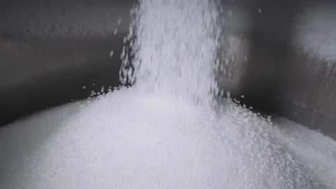 The plastic granules are poured into a large tank. Production of polymer Stock Footage 160611974