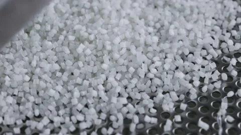 Plastic granules on a vibrating table. Polymer compound production Stock Footage 160611689