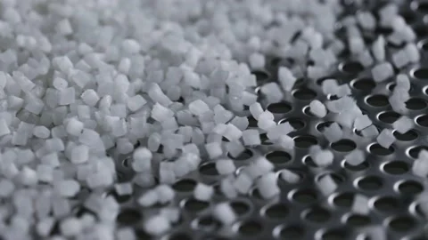 Plastic granules on a vibrating table. Polymer compound production Stock Footage 164137317