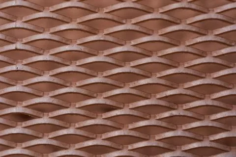 Plastic grille on the window with dust. Close-up. Macro effect photo. Stock Photos