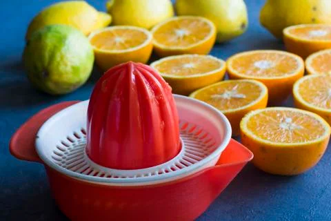 Plastic Hand Manual Juice Extractor and a lot oranges Stock Photos
