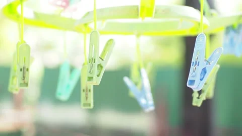 Plastic hanging clothespin, Many plastic clothespins on the clothesline, lau Stock Footage 136867940