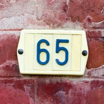 Plastic house number sixt five. - 65 Stock Photos