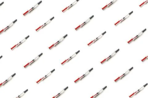 Plastic injectors pattern on white isolated Stock Photos