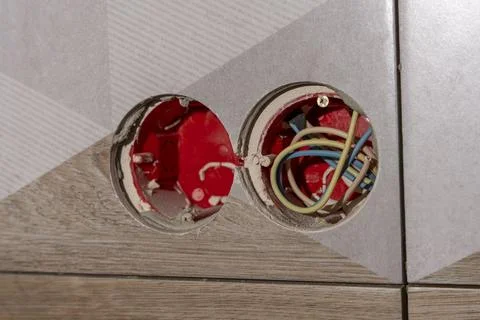 Plastic installation box for electrical outlets in ceramic tiles. Stock Photos