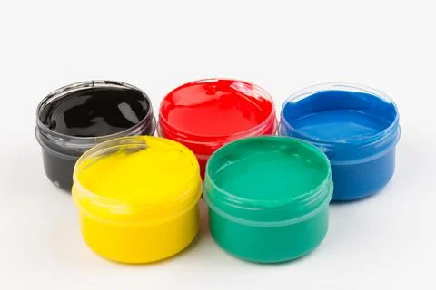 Plastic jars with paint of different colors for children's creativity on whit Stock Photos