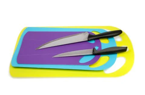 Plastic kitchen cutting board with knife isolated on the white Stock Photos