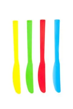 Plastic knives on a white background Stock Photos