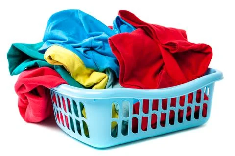 Plastic laundry basket with clothes. Stock Photos