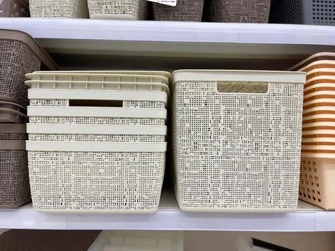 Plastic laundry baskets in the store. Items for storing things. Stock Photos