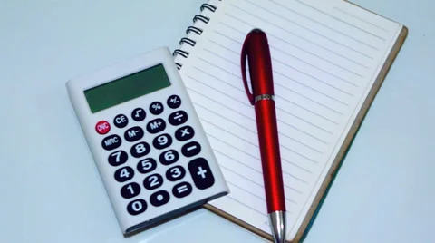 Plastic letter pieces with calculator, notepad and red pen 動画素材 39363135