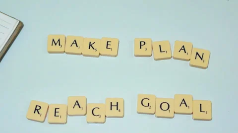 Plastic letter pieces with calculator, notepad and red pen Stock Footage 39364121