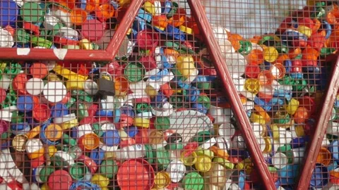 Plastic lids from bottles in a container. garbage. ecology Stock Footage 260416988