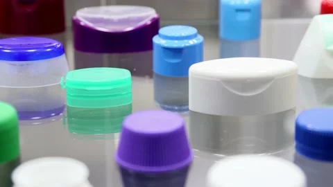 Plastic lids of different shapes and purposes in different colors Stock Footage 169340531