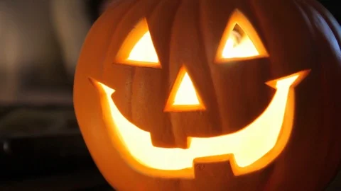 Plastic lit up jack o lantern close up Stock Footage 91545842