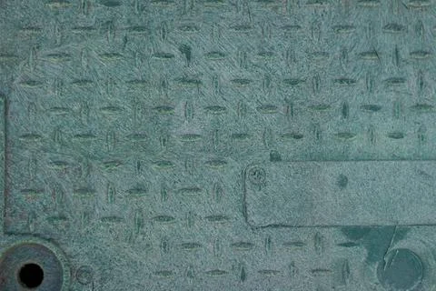 Plastic manhole cover with embossed pattern close up Fotos de archivo