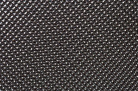 Plastic metalic dot pattern in grey image 库存照片