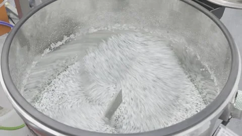 Plastic mixer machine, Plastic Polymer processing, Industrial manufacturing.  Stock Footage 337543611