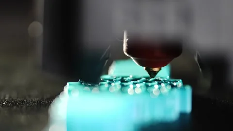 Plastic model being printed on a 3D printer with precise layered movement Stock Footage 321967712