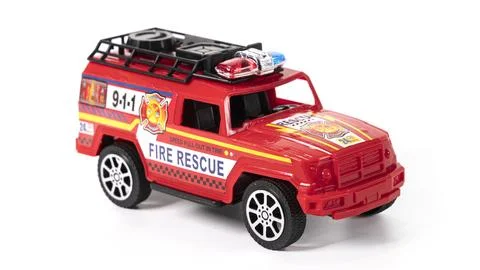 Plastic model fire brigade car isolated on white background. Stock Photos