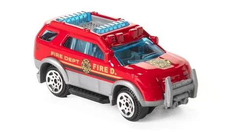 Plastic model fire brigade car isolated on white background. Stock Photos