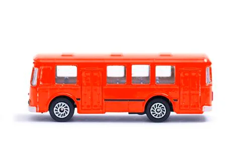 Plastic model of an old red bus, toy, miniature isolated on white Stock Photos