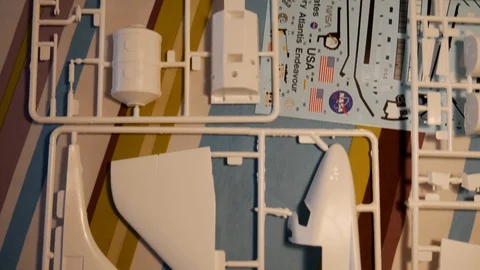 Plastic model spaceship kit, unassembled. Pan shot 스톡 동영상 111242754