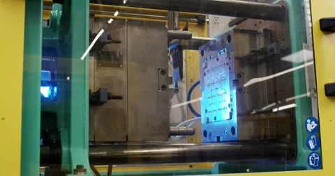 Plastic Molding Machine with Blue Lit Clamping Unit, Safety Guard, Static Shot Stock Footage 340659803