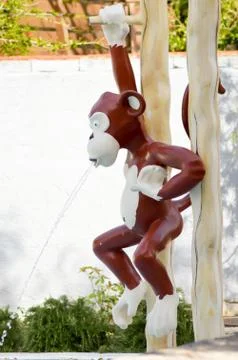 Plastic monkey used as a water Stock-Fotos