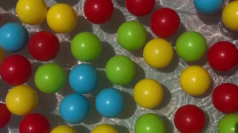 Plastic multicolored balls in the childrens inflatable pool Stock Footage 245925468
