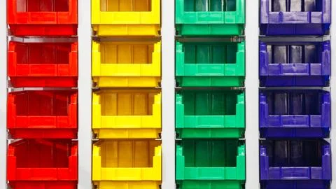 Plastic multicolored box containers on the modern warehouse for piece small s Foto stock