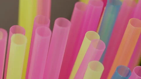 Plastic multicolored cocktail tubes, close-up, camera movement, rack focus Stock Footage 141810036