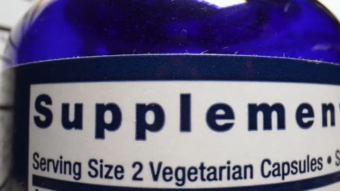 Plastic Nutritional Supplement Container. Supplement Fact Label. Stock Footage 312863243