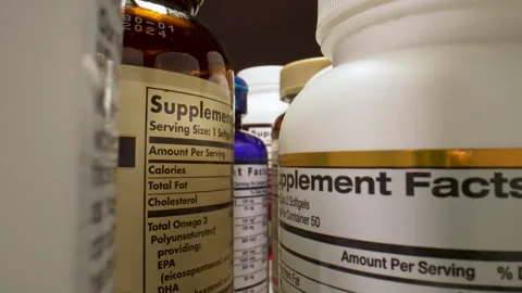 Plastic Nutritional Supplement Containers. The Basis of a Healthy Diet Stock Footage 257538877