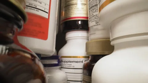 Plastic Nutritional Supplement Containers. The Camera Moves Through Many Plastic Stock Footage 258559313