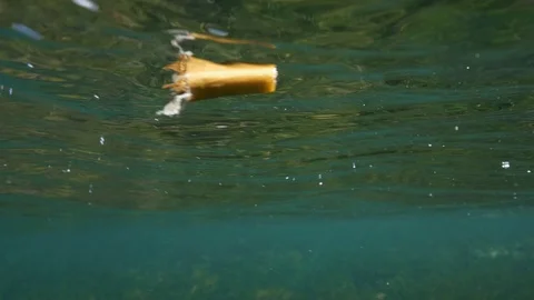 Plastic in the ocean, sea cigarette butt Stock Footage 102080150