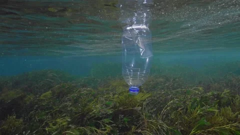 Plastic in the Ocean slow motion. Cinema High Quality footage. 4K Video stock 131209489