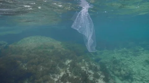 Plastic in the Ocean slow motion. Cinema High Quality footage. 4K Stock Footage 131209522
