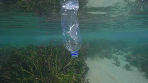 Plastic in the Ocean slow motion. Cinema High Quality footage. 4K Stock Footage 131209533