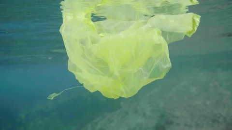 Plastic in the Ocean slow motion. Cinema High Quality footage. 4K Stock Footage 131209541