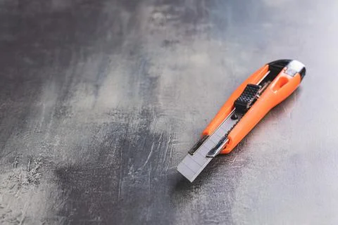 Plastic orange utility knife Stock Photos