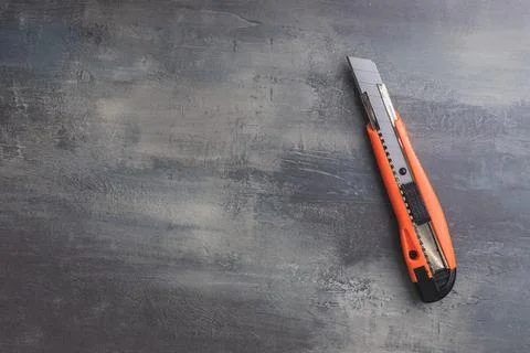 Plastic orange utility knife Stock Photos