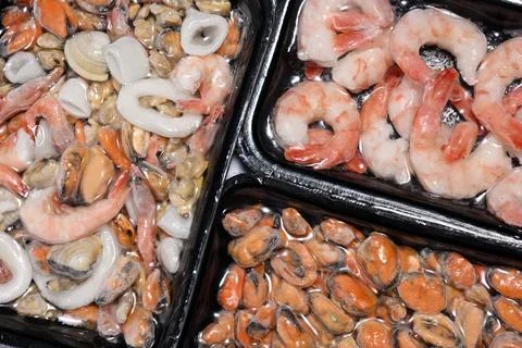 Plastic packages with seafood Fotos Stock