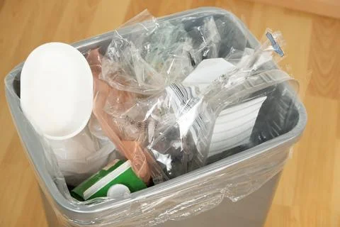 Plastic Packaging and Empty Containers in Domestic Waste Bin Indoor Stock Photos