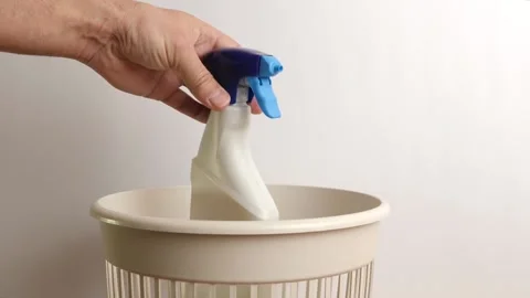 The plastic packaging from the detergent is thrown into the trash. Disposal and  Stock Footage 235436488