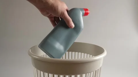 The plastic packaging from the detergent is thrown into the trash for recycli Stock Footage 261363117