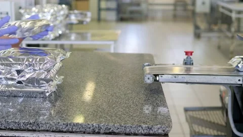 The plastic packaging machine on the production line packs food products Stock Footage 171894270