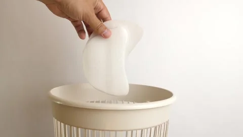 Plastic packaging material is recycled and thrown into the trash. The concept of Stock Footage 246002243