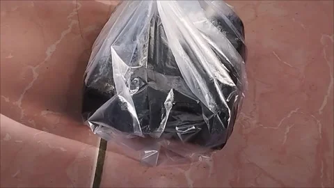 PLASTIC PACKAGING MICCAUTIONS PUT ON THE FLOOR Stock Footage 297027074